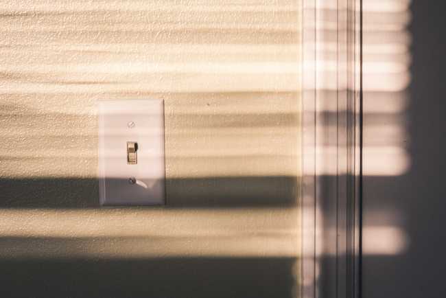 closup photograph of a lightswitch on a wall